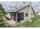 Exterior view of the home featuring a screened-in porch, siding, well-maintained lawn, and charming details at 6503 E Walton Dr, Camby, IN 46113