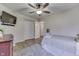 Cozy bedroom with a ceiling fan, closet, and a comfortable bed for a peaceful night's sleep at 6503 E Walton Dr, Camby, IN 46113