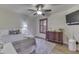Relaxing bedroom with a ceiling fan, wooden shutters, and stylish decor for a restful atmosphere at 6503 E Walton Dr, Camby, IN 46113
