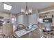 Elegant dining space with views into the kitchen, a chandelier, and natural lighting at 6503 E Walton Dr, Camby, IN 46113
