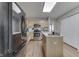 Spacious kitchen with stainless steel appliances, a convenient center island, and hardwood floors at 6503 E Walton Dr, Camby, IN 46113