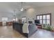 Spacious living room and dining area with ample seating, fireplace, and natural light at 6503 E Walton Dr, Camby, IN 46113