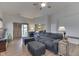 Comfortable living room with a large sofa, wood floors, and sliding glass doors at 6503 E Walton Dr, Camby, IN 46113