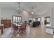 Spacious living room featuring a fireplace, a vaulted ceiling, hardwood floors, and natural light at 6503 E Walton Dr, Camby, IN 46113