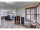 Open living space with wood floors connecting the dining area to the living room with a fireplace at 6503 E Walton Dr, Camby, IN 46113