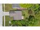 Aerial view of a home with a patio and mature trees surrounding the property at 6613 Apollo Way, Indianapolis, IN 46278