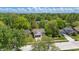 Aerial view of home surrounded by green trees in a neighborhood at 6613 Apollo Way, Indianapolis, IN 46278