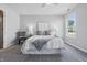 Comfortable bedroom with soft carpet, neutral decor, and windows that bring in natural light at 6613 Apollo Way, Indianapolis, IN 46278