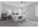 Serene bedroom with neutral colors, plush carpeting, and abundant natural light from two windows at 6613 Apollo Way, Indianapolis, IN 46278