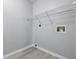 The laundry room offers gray walls, light flooring, wire shelf, and washer and dryer hookups at 6613 Apollo Way, Indianapolis, IN 46278