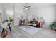 Bright and airy living room featuring vaulted ceilings, light gray walls, wood floors, and modern decor at 6613 Apollo Way, Indianapolis, IN 46278