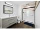 Bathroom with a sink and mirror as well as glass enclosed shower at 6673 Karyn Dr, Avon, IN 46123