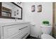 Modern bathroom featuring a vanity with storage, a large mirror, and neutral tones at 6673 Karyn Dr, Avon, IN 46123