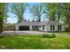 Charming single-story home featuring a two-car garage and well-manicured front lawn at 6673 Karyn Dr, Avon, IN 46123