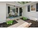 Inviting front porch with seating area and landscaping, perfect for relaxing and enjoying the outdoors at 6673 Karyn Dr, Avon, IN 46123