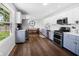 Bright eat-in kitchen featuring stainless steel appliances, two-tone cabinets and hardwood floors at 6673 Karyn Dr, Avon, IN 46123