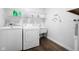Laundry room with white washer and dryer and shelves above at 6673 Karyn Dr, Avon, IN 46123