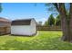 Well-maintained storage shed in a spacious, grassy backyard with mature trees and fencing at 6673 Karyn Dr, Avon, IN 46123