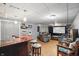Finished basement featuring a bar with stools and a home theater setup with comfortable seating at 6825 Farmleigh Dr, Indianapolis, IN 46220