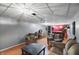 Spacious basement with a bar area, comfortable seating, wood-look floor and paneled walls, ideal for entertaining or relaxing at 6825 Farmleigh Dr, Indianapolis, IN 46220