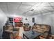 Finished basement featuring a bar with stools and a comfortable seating area for entertaining at 6825 Farmleigh Dr, Indianapolis, IN 46220