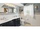 Elegant bathroom with double sink vanity, decorative mirror, and stylish accents at 6825 Farmleigh Dr, Indianapolis, IN 46220