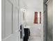 Bright bathroom featuring a sink, toilet, shower and a window with patterned curtains at 6825 Farmleigh Dr, Indianapolis, IN 46220