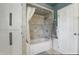 Cozy bathroom featuring a tiled shower, bathtub, and white vanity cabinet at 6825 Farmleigh Dr, Indianapolis, IN 46220