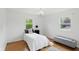 Cozy bedroom with hardwood floors, white walls, and a comfortable bed at 6825 Farmleigh Dr, Indianapolis, IN 46220