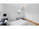 Bedroom featuring a window, closet, hardwood floors, and a neutral color scheme at 6825 Farmleigh Dr, Indianapolis, IN 46220