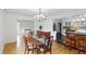 Dining room with wood floors adjacent to the kitchen, great for gatherings and easy access at 6825 Farmleigh Dr, Indianapolis, IN 46220