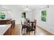 Bright dining room features wood floors, traditional furniture, and a chandelier for elegant dining at 6825 Farmleigh Dr, Indianapolis, IN 46220