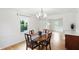Elegant dining room with traditional decor, wood floors, and plenty of natural light at 6825 Farmleigh Dr, Indianapolis, IN 46220