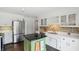 Well-equipped kitchen with white cabinets, stainless steel appliances, and lots of counter space at 6825 Farmleigh Dr, Indianapolis, IN 46220