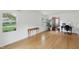 Bright living room featuring hardwood floors and an adjacent office space with natural light at 6825 Farmleigh Dr, Indianapolis, IN 46220