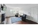 Inviting living room features hardwood floors, fireplace, and natural light from windows at 6825 Farmleigh Dr, Indianapolis, IN 46220