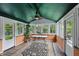 Sunroom with ample windows offers natural light and views of the outdoor landscape at 6825 Farmleigh Dr, Indianapolis, IN 46220