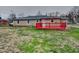 Backyard with a red deck and a view of the exterior of the home, great for entertaining at 6985 E County 100 S Rd, Avon, IN 46123