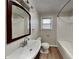 Bright bathroom with updated fixtures, including a tub, toilet, vanity and mirror at 6985 E County 100 S Rd, Avon, IN 46123