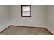 Neutral bedroom featuring carpet, window with blinds, and a clean, simple design at 6985 E County 100 S Rd, Avon, IN 46123