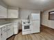 Functional kitchen equipped with white appliances and ample cabinet space at 6985 E County 100 S Rd, Avon, IN 46123