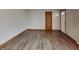 Bright living room featuring wood-look flooring and neutral walls, ready for your personal touch at 6985 E County 100 S Rd, Avon, IN 46123