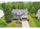 An aerial view showcases a home with a manicured lawn and lovely landscaping at 7388 Wythe Dr, Noblesville, IN 46062
