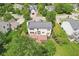 Bird's eye view of the backyard, highlighting the deck and mature trees which create a private and serene outdoor space at 7388 Wythe Dr, Noblesville, IN 46062