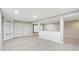 Finished basement with neutral walls, white trim, carpet, and white built-ins at 7388 Wythe Dr, Noblesville, IN 46062
