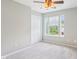 A cozy bedroom with a ceiling fan, plush carpet, and sun-lit windows at 7388 Wythe Dr, Noblesville, IN 46062