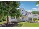 Beautiful two-story home with a covered front porch and mature trees at 7388 Wythe Dr, Noblesville, IN 46062