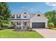 Charming two-story home with a welcoming front porch and well-maintained landscaping at 7388 Wythe Dr, Noblesville, IN 46062