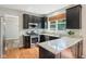 Kitchen features stainless steel appliances, granite countertops, and dark cabinets at 7388 Wythe Dr, Noblesville, IN 46062