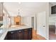 Open-concept kitchen showcasing granite countertops, modern appliances, and spacious living area at 7388 Wythe Dr, Noblesville, IN 46062
